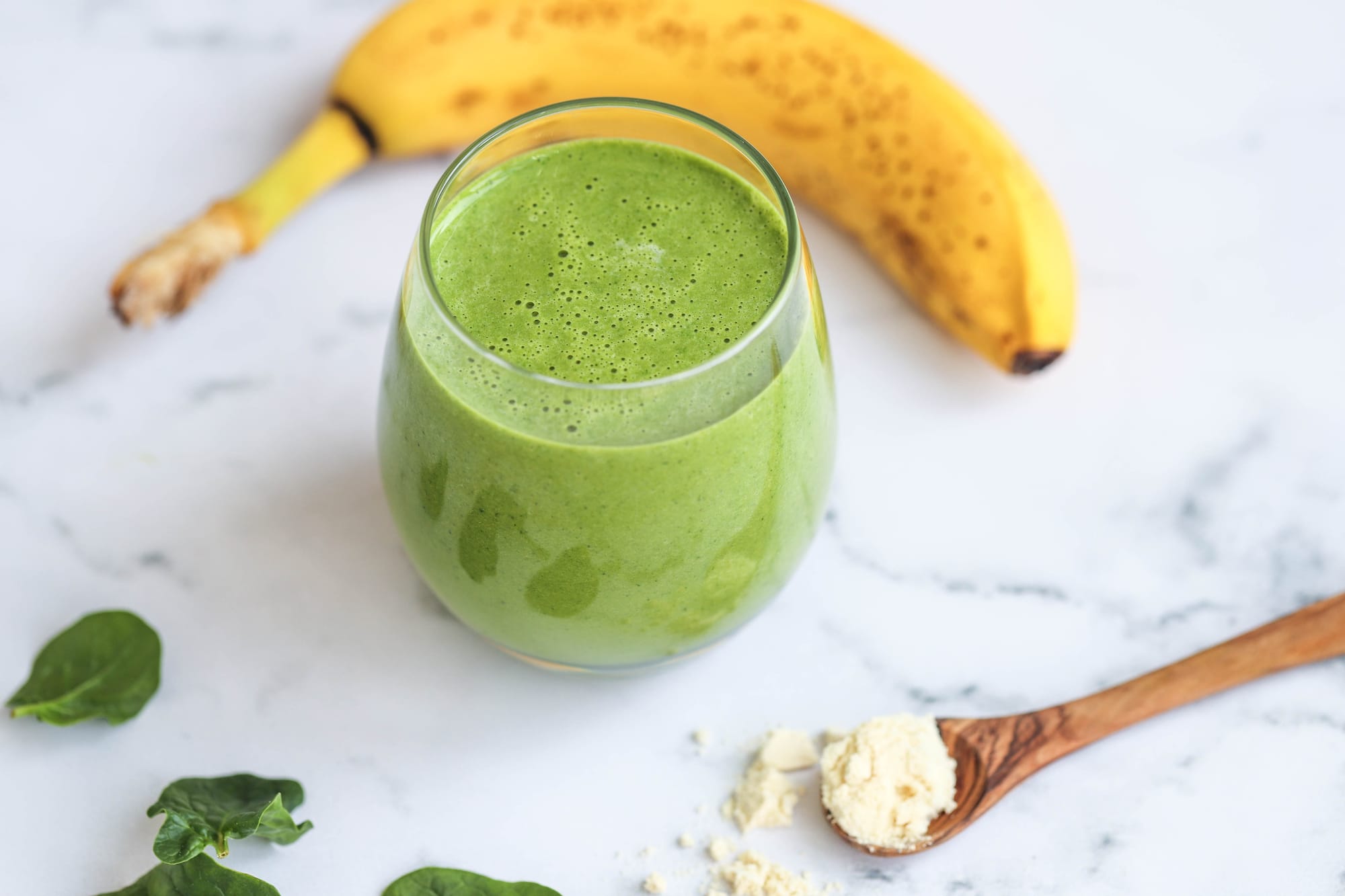 Green smoothie packed with nutritious ingredients, perfect for reducing stress and promoting overall well-being.