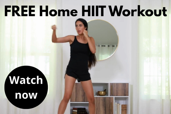 Woman doing home HIIT workout on exercise mat during full-body training session