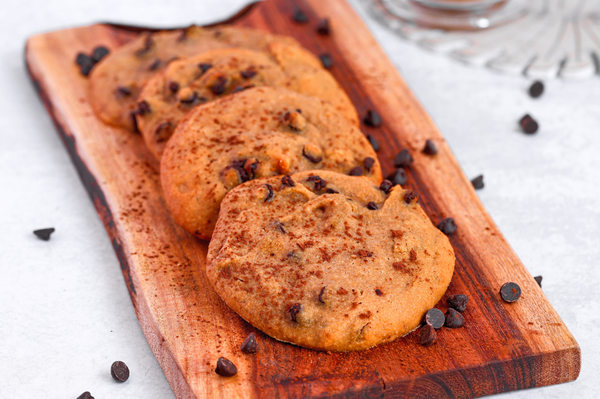 Stack of high-protein chocolate chip cookies with melted chocolate chips
